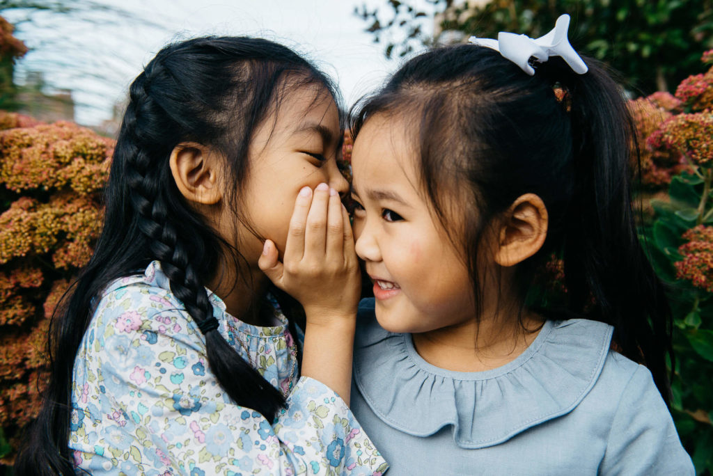 girl sitting on vintage bus seat with warm sunlight, nostalgic kids portrait