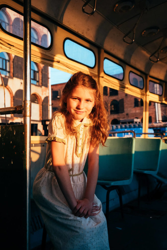 girl in colorful outfit with unique hat, playful fashion kids portrait